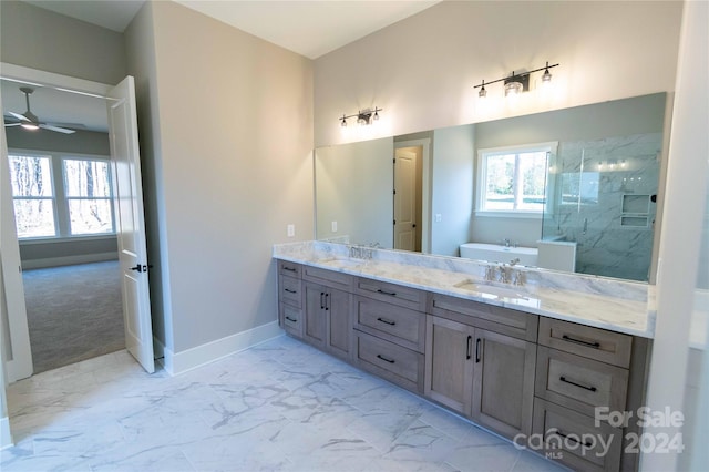 bathroom featuring vanity, ceiling fan, and independent shower and bath