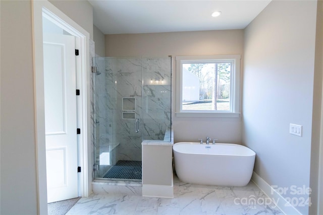 bathroom with separate shower and tub