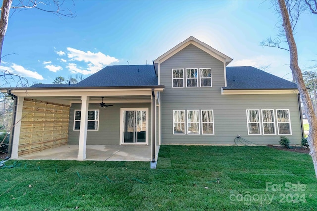 back of house with a lawn, ceiling fan, and a patio area