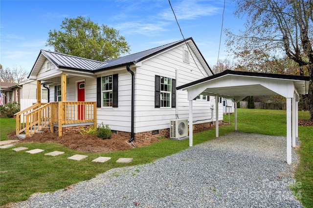 view of front facade with a front lawn, ac unit, and covered porch