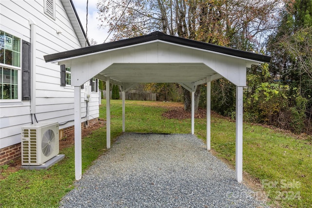 view of parking featuring a lawn, a carport, and ac unit