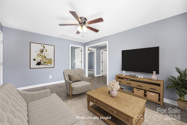 living room featuring hardwood / wood-style flooring and ceiling fan