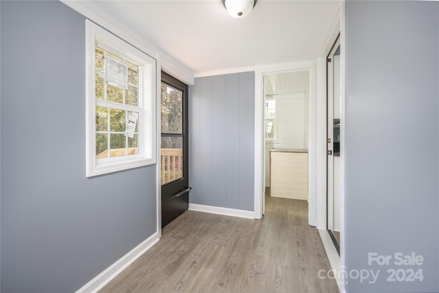 hall with light hardwood / wood-style floors