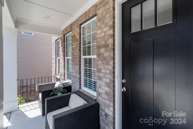 entrance to property featuring covered porch