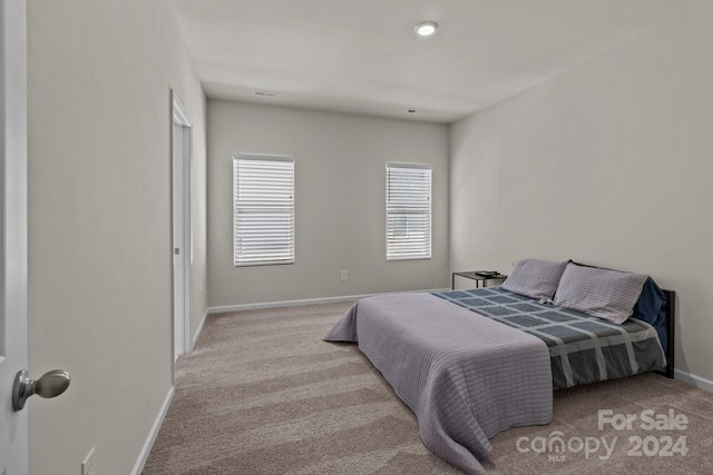 bedroom with light carpet