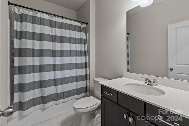 full bathroom featuring shower / bath combo with shower curtain, vanity, and toilet