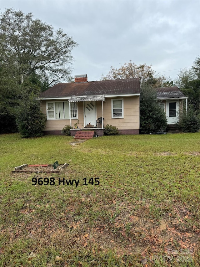 ranch-style home with a front yard