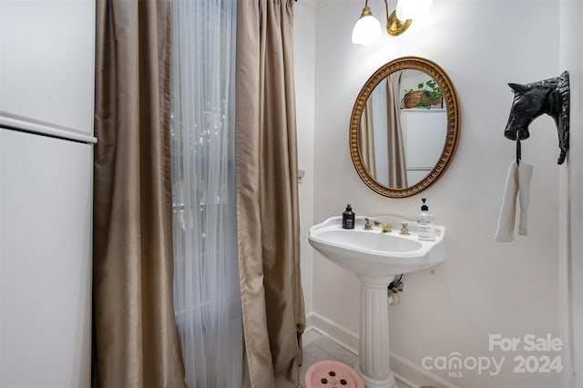 bathroom featuring tile patterned flooring