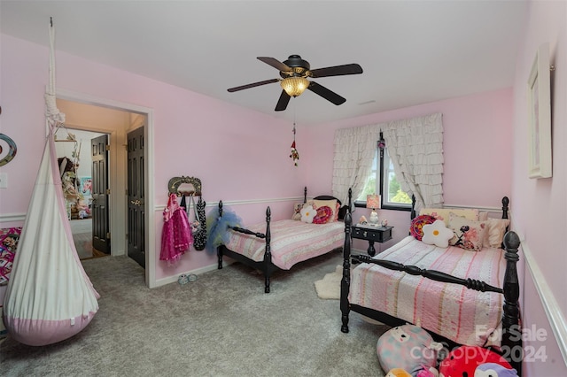 bedroom featuring ceiling fan and light carpet