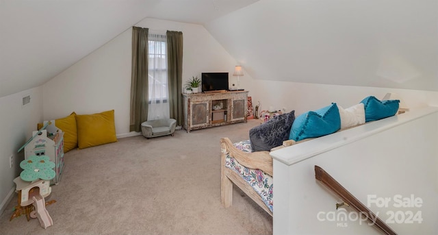 interior space with carpet and vaulted ceiling