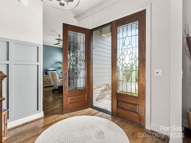 foyer featuring hardwood / wood-style flooring and ceiling fan