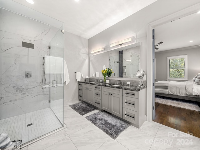 bathroom with walk in shower, ceiling fan, hardwood / wood-style floors, vanity, and crown molding