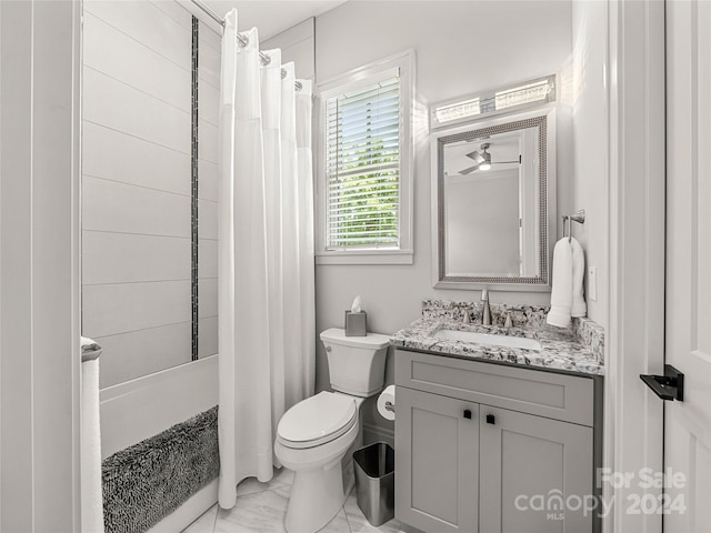 bathroom featuring walk in shower, vanity, and toilet