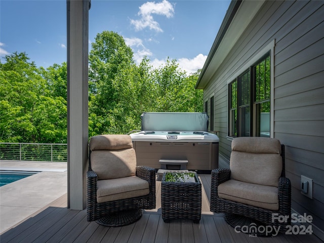 deck featuring a hot tub