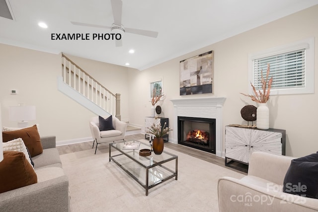 living room featuring ceiling fan and light wood-type flooring