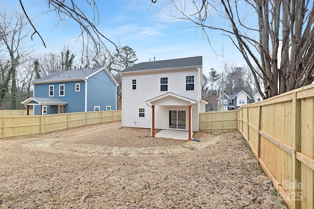 back of house with a patio