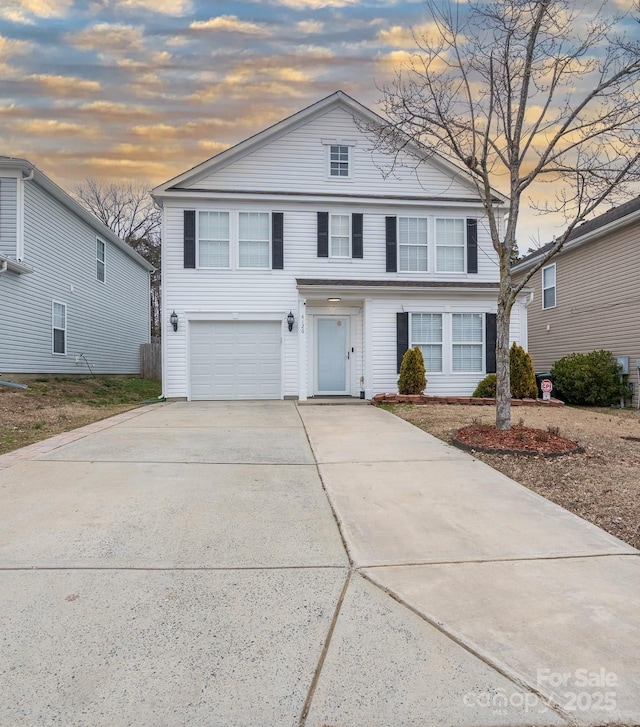 front of property with a garage