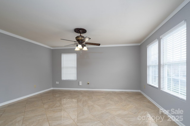 spare room featuring ceiling fan and crown molding