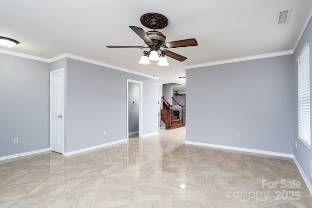 unfurnished room featuring ceiling fan and crown molding