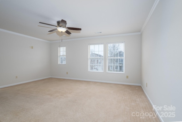 unfurnished room with crown molding, ceiling fan, and light carpet