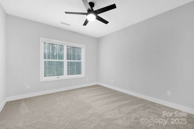 unfurnished room featuring carpet flooring and ceiling fan