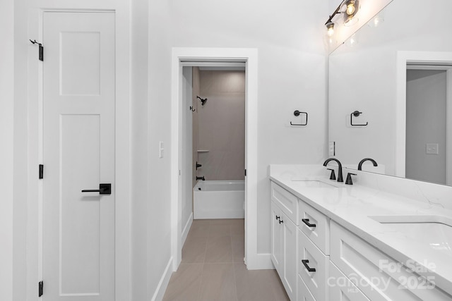 bathroom with shower / bathing tub combination, tile patterned flooring, and vanity