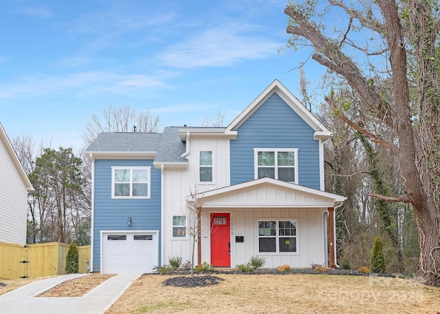 view of front of home featuring a front yard and a garage