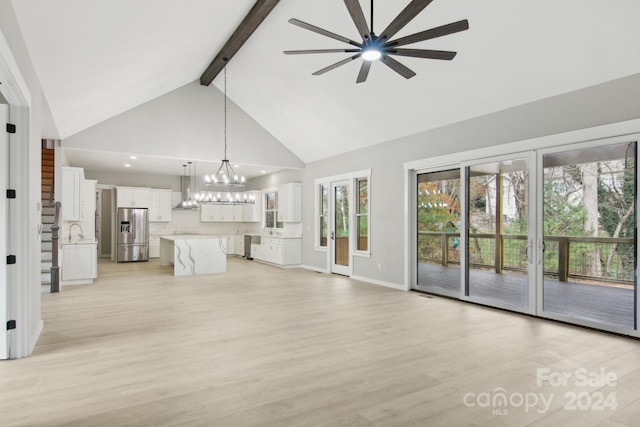 unfurnished living room with beamed ceiling, sink, ceiling fan with notable chandelier, high vaulted ceiling, and light wood-type flooring