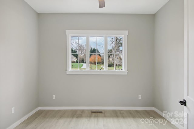 unfurnished room with ceiling fan and light hardwood / wood-style flooring