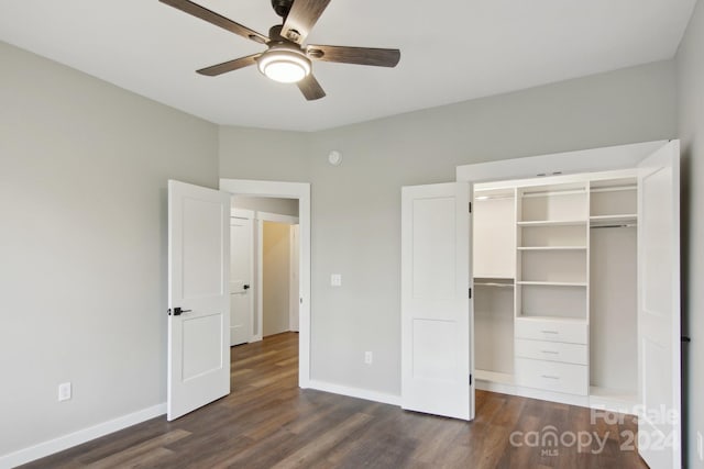 unfurnished bedroom featuring dark wood-type flooring, ceiling fan, and a closet