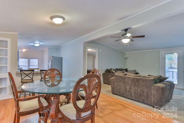 dining area with plenty of natural light, ceiling fan, crown molding, and light hardwood / wood-style flooring