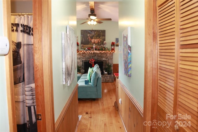 corridor with light hardwood / wood-style floors