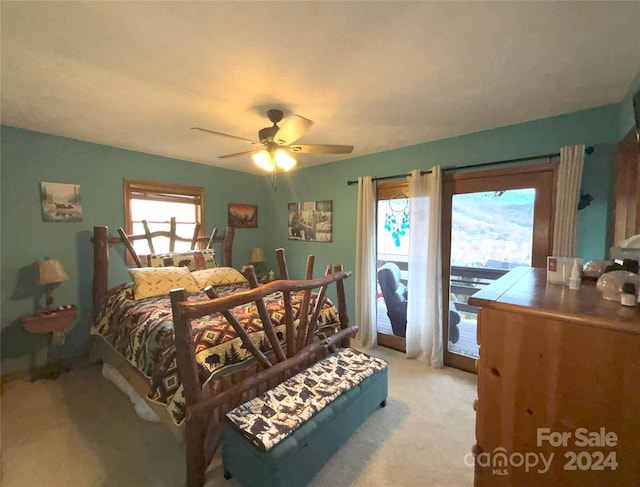 12 Boulder Ln, Maggie Valley, NC 28751 - bedroom with access to exterior, light carpet, and ceiling fan
