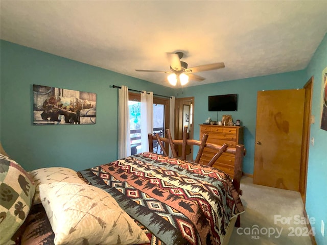 bedroom with ceiling fan and light colored carpet