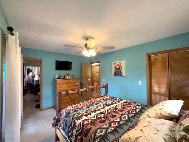 bedroom with carpet flooring, ceiling fan, and a closet