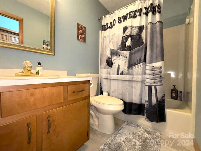 full bathroom with toilet, vanity, tile patterned floors, and shower / tub combo with curtain