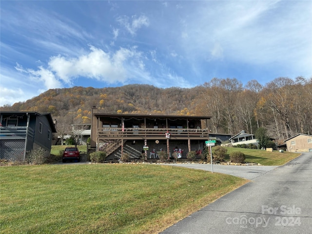 12 Boulder Ln, Maggie Valley, NC 28751 - view of front of property with a front yard and a mountain view