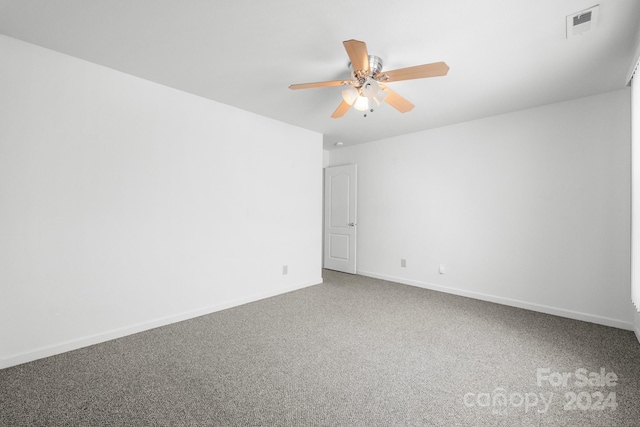 empty room with carpet and ceiling fan