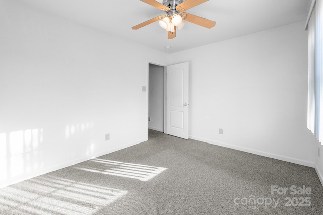 spare room featuring ceiling fan and carpet