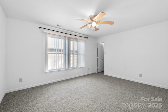 spare room with carpet floors and ceiling fan