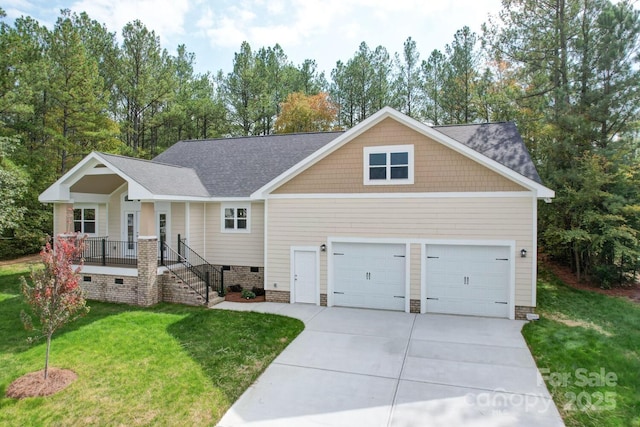 view of front of home with a front lawn, a porch, and a garage