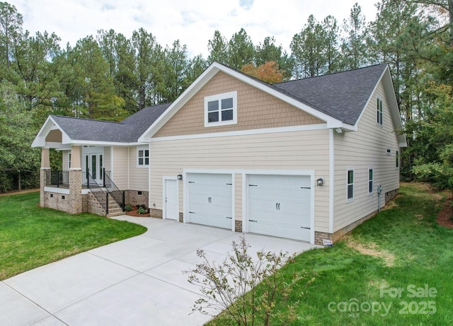 view of front facade with a garage and a front lawn