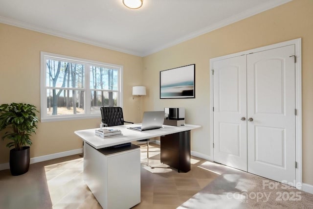 carpeted office space featuring ornamental molding