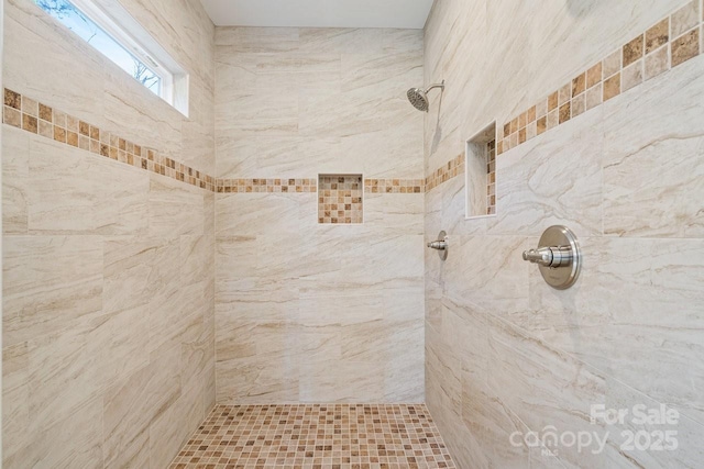 bathroom featuring tiled shower