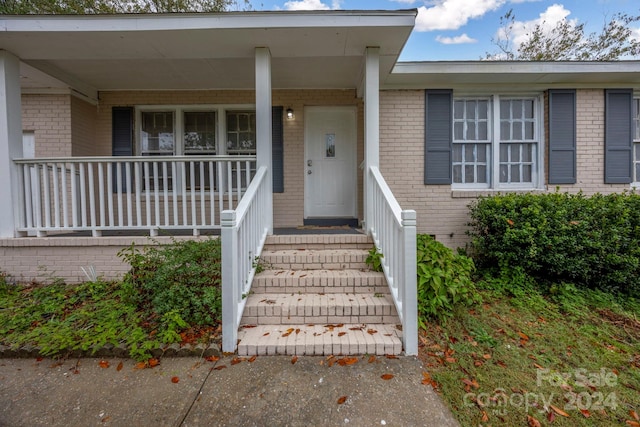 property entrance with a porch