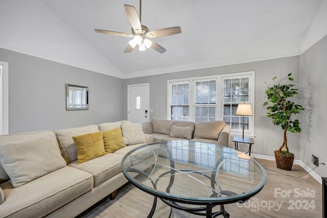 living room with lofted ceiling, ceiling fan, and light hardwood / wood-style flooring