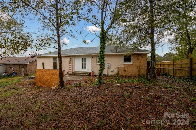 back of house with a patio