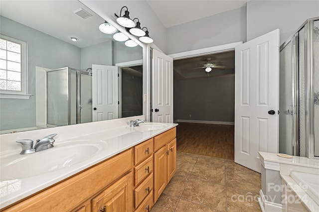 bathroom featuring ceiling fan, vanity, a shower with shower door, and wood-type flooring