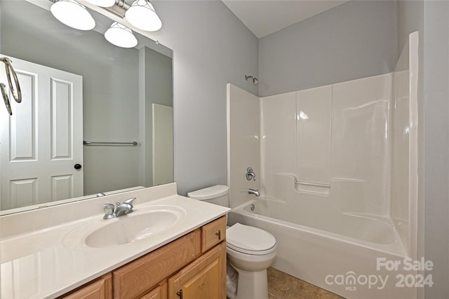 full bathroom featuring toilet, shower / bathing tub combination, vanity, and tile patterned floors