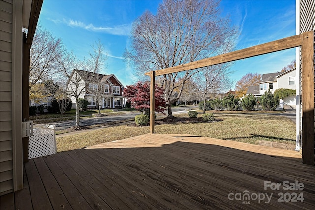 wooden deck with a yard